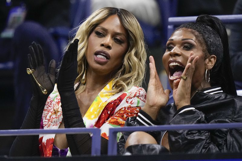 Actress Laverne Cox, left, watches play between Frances Tiafoe, of the United States, and Taylor Fritz, of the United States, during the men's singles semifinal of the U.S. Open tennis championships, Friday, Sept. 6, 2024, in New York. (AP Photo/Frank Franklin II)