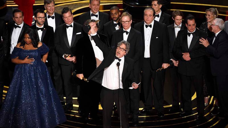 Peter Farrelly, center, and the cast and crew of "Green Book" accept the award for best picture at the Oscars on Sunday, Feb. 24, 2019, at the Dolby Theatre in Los Angeles.