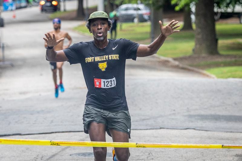 Maurice Garland is the first person to cross the finish line with a time of 18:39 during the 17th Annual Atlanta HBCU Alumni Alliance 5K Run/Walk at Piedmont Park on Saturday morning, June 29, 2024.   (Steve Schaefer / AJC)