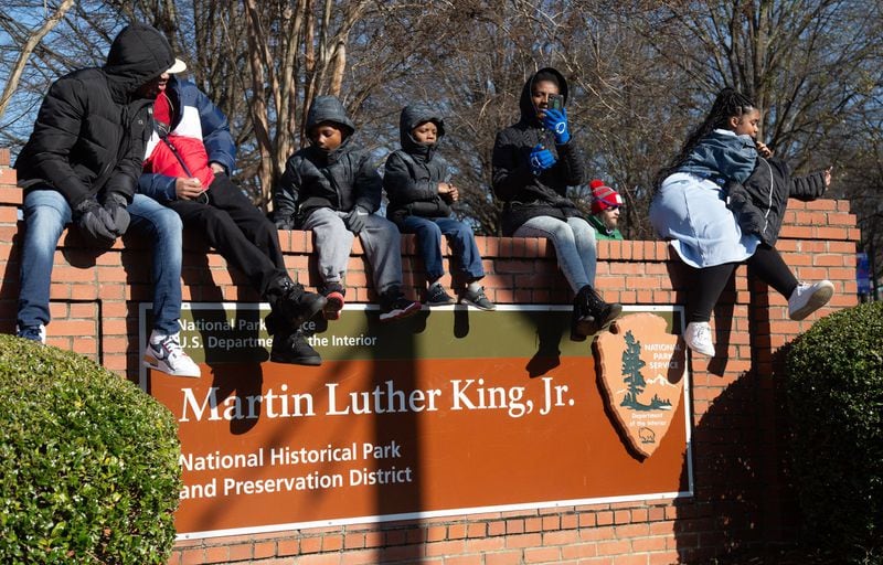 Spectators watch the Dr. Martin Luther King Jr. Holiday Commemorative March head down Auburn Avenue on Jan. 20, 2020. STEVE SCHAEFER / SPECIAL TO THE AJC