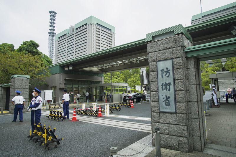 FILE - This photo shows an exterior view of the Defense Ministry of Japan with its sign at the main entrance in Tokyo on Sept. 17, 2021. (AP Photo/Hiro Komae, File)