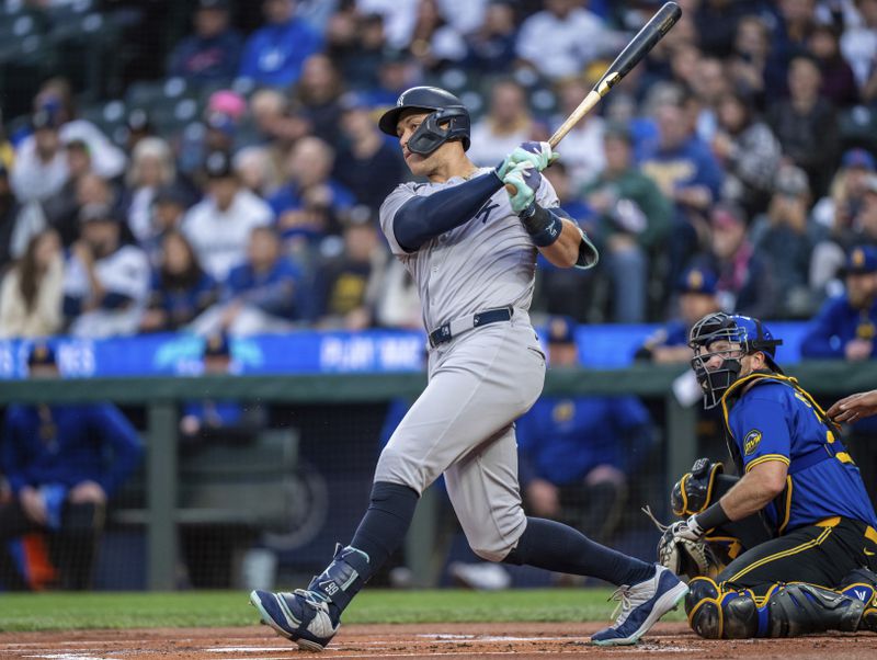 New York Yankees' Aaron Judge hits a two-run designated hitter during the first inning of a baseball game against the Seattle Mariners, Tuesday, Sept. 17, 2024, in Seattle. (AP Photo/Stephen Brashear)