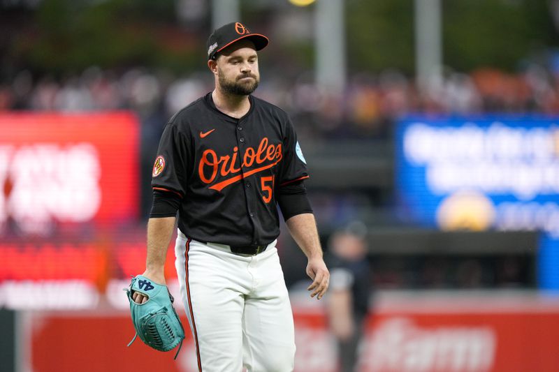 Baltimore Orioles pitcher Danny Coulombe heads to the dugout after being relieved during the fifth inning in Game 2 of an AL Wild Card Series baseball game against the Kansas City Royals, Wednesday, Oct. 2, 2024 in Baltimore. (AP Photo/Stephanie Scarbrough)