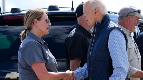 President Joe Biden talks with Deanne Criswell, Administrator of the Federal Emergency Management Agency (FEMA), as he arrives at Greenville-Spartanburg International Airport in Greer, S.C., Wednesday, Oct. 2, 2024, to survey damage from Hurricane Helene. (AP Photo/Susan Walsh)