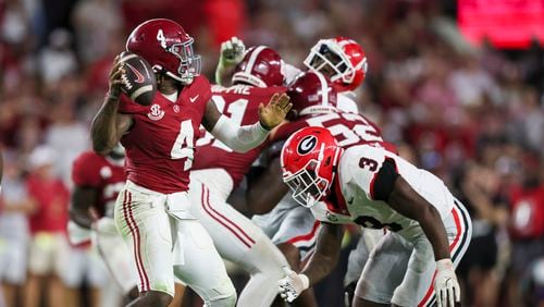 Alabama quarterback Jalen Milroe (4) attempts a pass as Georgia linebacker CJ Allen (3) pressures Milroe during the second half at Bryant-Denny Stadium, Saturday, Sept. 28, 2024, in Tuscaloosa, Al. Alabama won 41-34. (Jason Getz / AJC)

