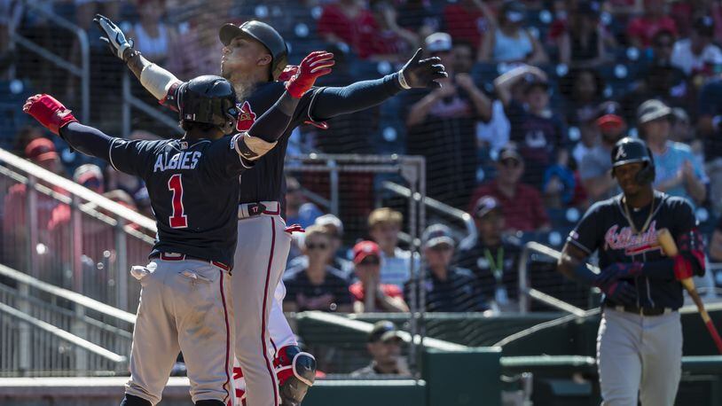 Ozzie Albies of the Atlanta Braves celebrates after hitting a two