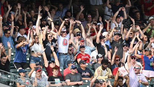 Braves fans cheer in the ninth inning at Truist Park on July 9, 2022. The Braves won 4-3 over Washington Nationals. (Hyosub Shin / Hyosub.Shin@ajc.com)