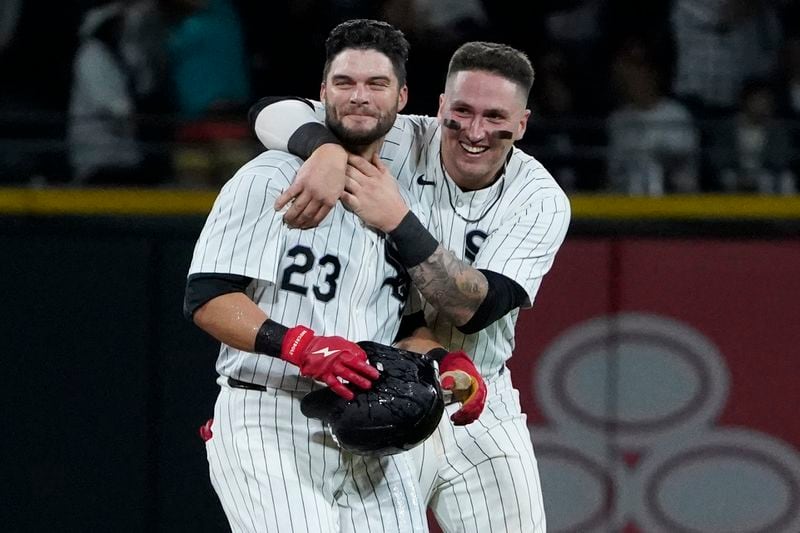 Chicago White Sox's Andrew Benintendi, left, celebrates his walk-off RBI single with catcher Korey Lee, right, against the Los Angeles Angels during the tenth inning of a baseball game, Wednesday, Sept. 25, 2024, in Chicago. (AP Photo/David Banks)