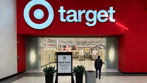 FILE - A shopper heads into a Target store on Jan. 11, 2024, in Lakewood, Colo. (AP Photo/David Zalubowskim File)