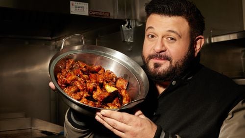 Adam Richman explores the origins of Panda Express' Orange Chicken in an episode of History Channel's "Adam Eats the 80s." MAGGIE SHANNON