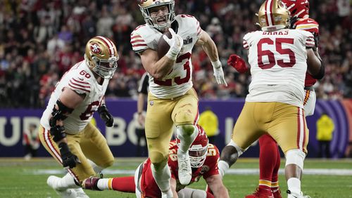FILE - San Francisco 49ers running back Christian McCaffrey (23) runs into the end zone for a topuchdown against the Kansas City Chiefs during the first half of the NFL Super Bowl 58 football game Sunday, Feb. 11, 2024, in Las Vegas. (AP Photo/George Walker IV, File)