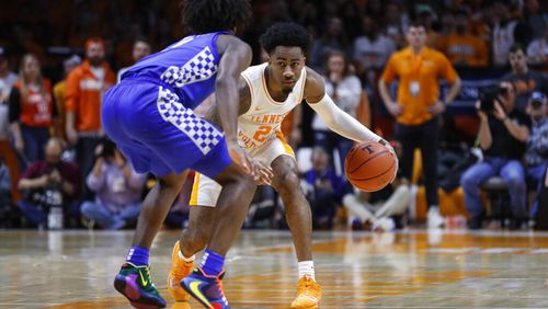 Tennessee guard Jordan Bowden (23) works the ball as he's defended by Kentucky guard Immanuel Quickley (5) during an NCAA college basketball game Saturday, Feb. 8, 2020, in Knoxville, Tenn. Kentucky won 77-64. (AP Photo/Wade Payne)