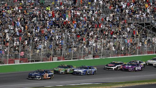 Joey Logano (22) leads a line of cars during a NASCAR Cup Series auto race at Atlanta Motor Speedway, Sunday, Sept. 8, 2024, in Hampton, Ga. (Hyosub Shin/Atlanta Journal-Constitution via AP)