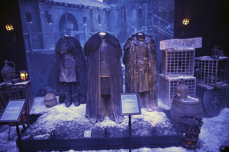 FILE - Costumes from the characters Alliser Thorne and Jon Snow on display at the launch of The Game of Thrones Touring Exhibition at the Titanic Exhibition centre in Belfast, Northern Ireland, Wednesday, April 10, 2019. (AP Photo, File)