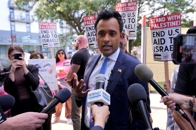 Former Republican presidential candidate and entrepreneur Vivek Ramaswamy talks to the media at demonstration near the Democratic National Convention Thursday, Aug. 22, 2024, in Chicago. (AP Photo/Alex Brandon)