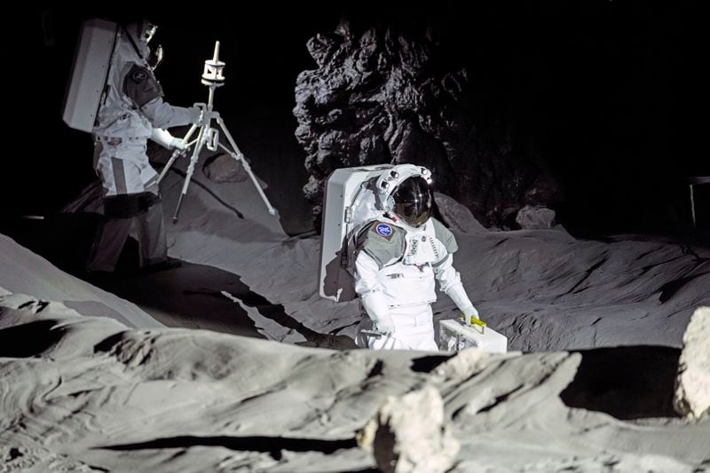 Astronauts Thomas Pesquet of France and Matthias Maurer of Germany demonstrate their training in lunar surface simulating conditions for future moon missions, like the Artemis lunar exploration program led by NASA, at the opening of the new LUNA facility at the European Astronaut Center in Cologne, Germany, Wednesday, Sept. 25, 2024. (AP Photo/Martin Meissner)