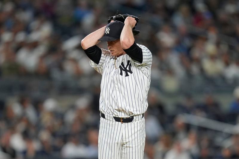 New York Yankees pitcher Tim Hill reacts after loading the bases during the fifth inning of a baseball game against the Cleveland Guardians at Yankee Stadium Tuesday, Aug. 20, 2024, in New York. (AP Photo/Seth Wenig)