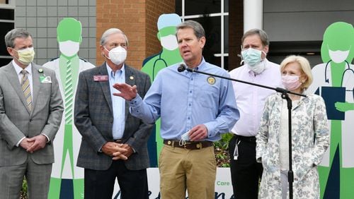 Governor Brian Kemp speaks after he toured a temporary medical pod and a pop-up hospital in the parking garage at Floyd Medical Center on Wednesday, May 13, 2020. (Hyosub Shin / Hyosub.Shin@ajc.com)