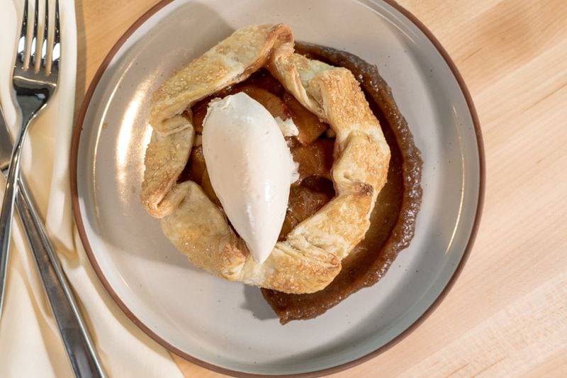 Indaco's apple crostata uses the fruit in the filling, in the whipped panna topping and in a swatch of richly concentrated apple butter. Courtesy of Ann Packwood Photography