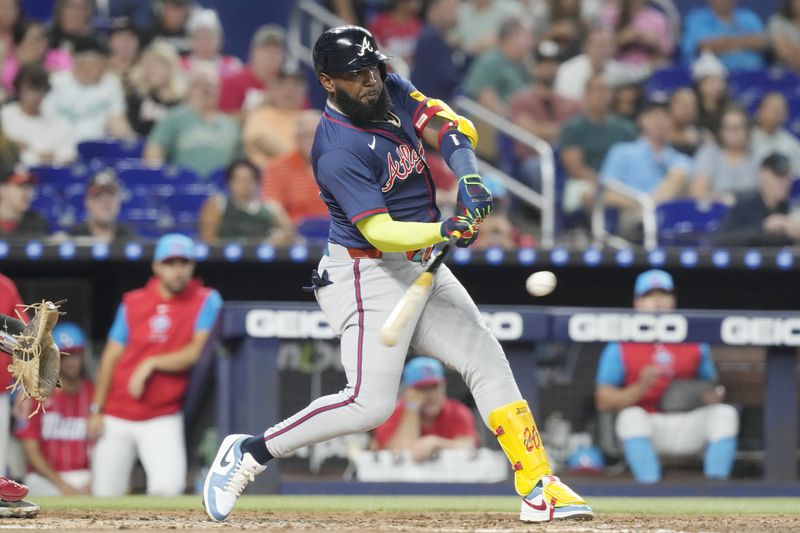 Atlanta Braves' Marcell Ozuna hits a single to left field during the third inning of a baseball game against the Miami Marlins, Saturday, Sept. 21, 2024, in Miami. (AP Photo/Marta Lavandier)