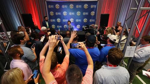 Alabama Crimson Tide quarterback Bryce Young is surrounded by news media asking questions during his press conference at SEC Media Days in the College Football Hall of Fame on Tuesday, July 19, 2022, in Atlanta.  Curtis Compton / Curtis Compton@ajc.com
