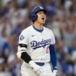 Los Angeles Dodgers' Shohei Ohtani reacts after hitting a three-run home run during the second inning in Game 1 of baseball's NL Division Series against the San Diego Padres, Saturday, Oct. 5, 2024, in Los Angeles. (AP Photo/Mark J. Terrill)