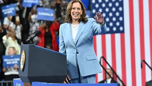 Vice President Kamala Harris waves as she walks on the stage at a rally at the Georgia State University’s convocation center in Atlanta on Tuesday, July 30, 2024.  It is her first campaign event in Georgia since she became the presumptive Democratic nominee. (Hyosub Shin / Hyosub.Shin / ajc.com)