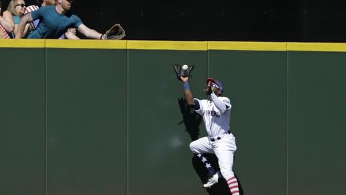 Seattle Mariners center fielder Guillermo Heredia catches a fly ball for an out hit by Kansas City Royals' Alex Gordon during the second inning of a baseball game, Tuesday, July 4, 2017, in Seattle. (AP Photo/John Froschauer)