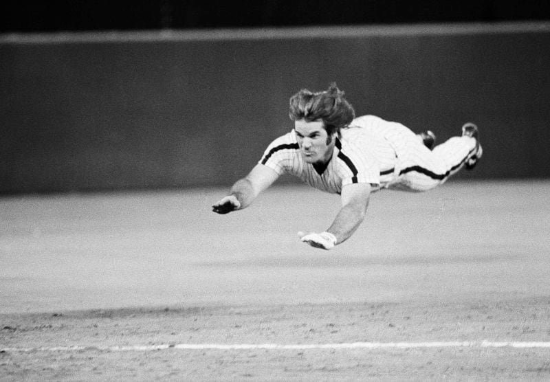 FILE - Philadelphia Phillies' Pete Rose slides to third base during a baseball game against the New York Mets in Philadelphia, June 3, 1981. (AP Photo/Rusty Kennedy, File)