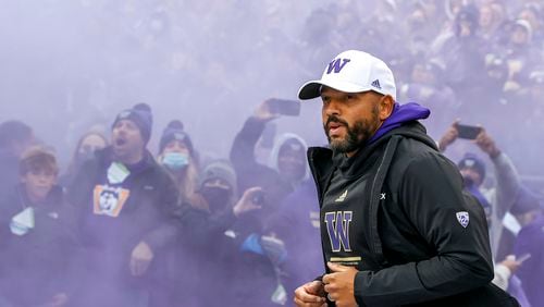 Washington head coach Jimmy Lake takes the field before a game against Oregon at Husky Stadium on Nov. 6, 2021, in Seattle. (Steph Chambers/Getty Images/TNS)