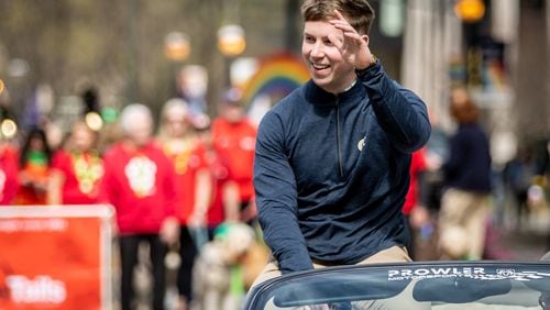 Grand marshal and Georgia Tech football player David Shanahan waves to the crowd during Atlanta's St. Patrick's Parade on Saturday, March 11, 2023. Shanahan is from Castleisland, County Kerry, Ireland. (Photo: Steve Schaefer / steve.schaefer@ajc.com)