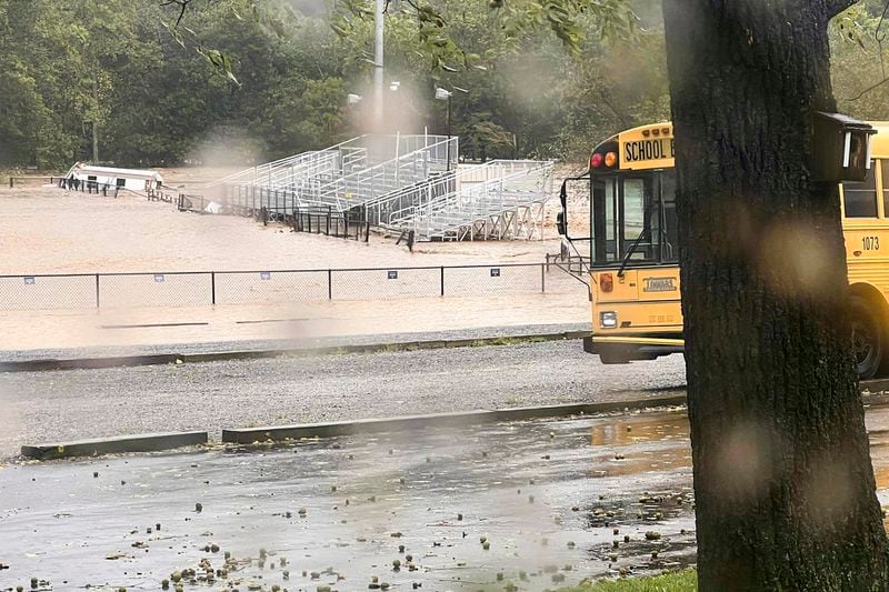 This photo provided by Kelly Benware shows flooding around the football field at Asheville Christian Academy in Swannanoa, N.C., on Friday, Sept. 27, 2024. (Kelly Benware via AP)