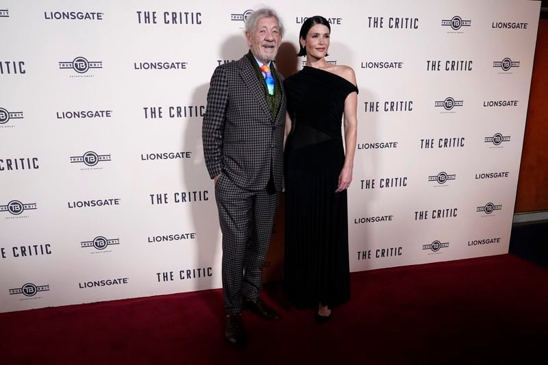 Ian McKellen, with Gemma Arterton, as they pose for photographers upon arrival at the European Premiere of the The Critic, In London, Monday, Sept. 2, 2024. (AP Photo/Alberto Pezzali)