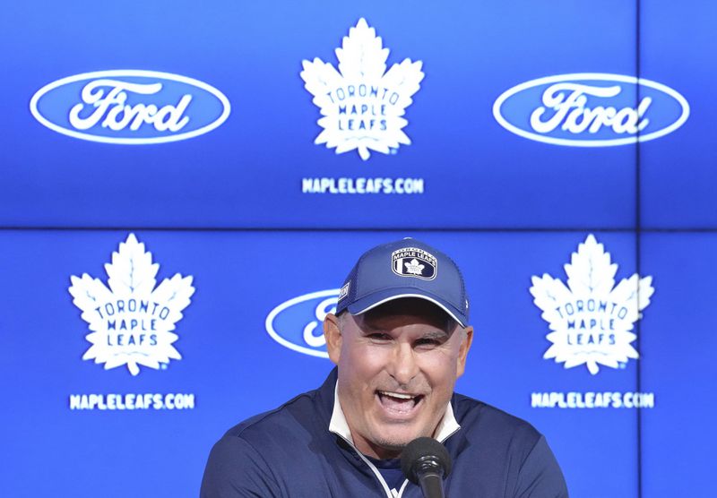 Toronto Maple Leafs new head coach Craig Berube speaks to the media during a press conference at the start of the NHL hockey team's training camp in Toronto, Wednesday, Sept. 18, 2024. (Nathan Denette/The Canadian Press via AP)