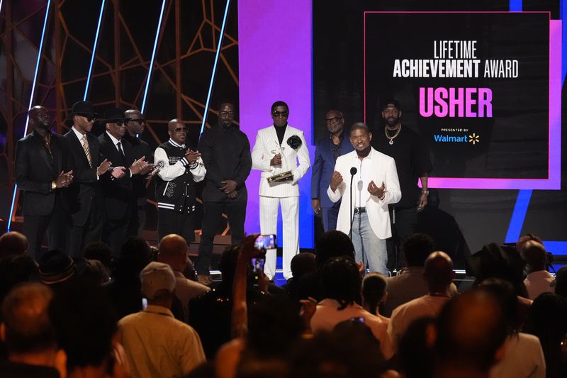 Usher accepts the Lifetime Achievement award during the BET Awards on Sunday, June 30, 2024, at the Peacock Theater in Los Angeles. (AP Photo/Chris Pizzello)