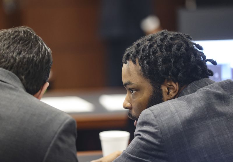 Defendant Deobra Redden, right, speaks to his attorney during his trial at the Regional Justice Center in Las Vegas, Thursday, Sept. 5, 2024. (Rachel Aston/Las Vegas Review-Journal via AP)