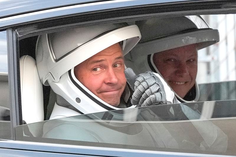 NASA astronaut Nick Hague, left, and Roscosmos cosmonaut Aleksandr Gorbunov, left, gives a thumbs up as they leave the Operations and Checkout Building on their way to Launch Complex 40 for a mission to the International Space Station Saturday, Sept. 28, 2024 at Cape Canaveral, Fla., (AP Photo/John Raoux)