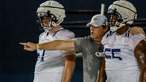 Senior Football Advisor Allen Mogridge (center) gives directions to linebackers during the second day of football practice at the Brock Indoor Practice Facility on Thursday, July 25, 2024, in Atlanta. (Miguel Martinez / AJC)