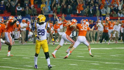 Clemson defeats LSU 25-24 with a last second field goal by Chandler Catanzaro (39) to win the Chick-fil-A Bowl in Atlanta on Monday, Dec. 31, 2012. LSU defender Jalen Mills walks off the field while the Clemson sideline errupts. CURTIS COMPTON / CCOMPTON@AJC.COM