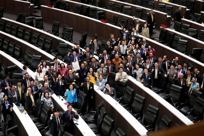 Pheu Thai party lawmakers celebrate after Thailand’s Parliament elected the party's leader Paetongtarn Shinawatra as the country’s new prime minister at Parliament in Bangkok, Thailand, Friday, Aug. 16, 2024. (AP Photo/Sakchai Lalit)