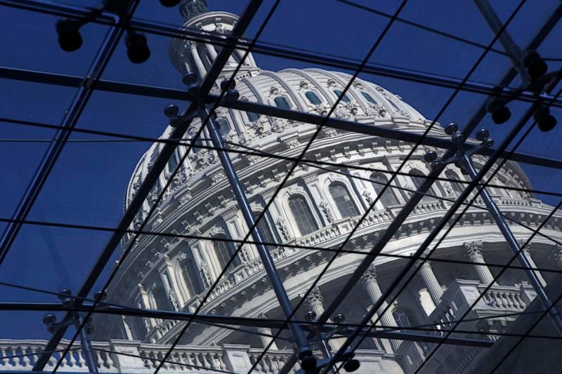 FILE - The Capitol dome on Capitol Hill is seen through a glass structure in Washington, on April 6, 2011. (AP Photo/J. Scott Applewhite, File)