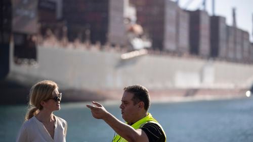 U.S. Agency for International Development Administrator Samantha Power, left, talks to Robt Pellech, manager of the containers department of Ashdod port as they visit the area where cargo ships arrive, carrying humanitarian aid for Gaza Strip, in Ashdod, Israel, Thursday, July 11, 2024. (AP Photo/Leo Correa)