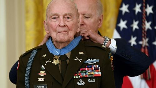 U.S. President Joe Biden presents the Medal of Honor to 94-year-old retired Army Col. Ralph Puckett, Jr., for conspicuous gallantry while serving during the Korean War, in a ceremony in the East Room of the White House in Washington, D.C. on May 21, 2021. (Brendan Smialowski/AFP/Getty Images/TNS)