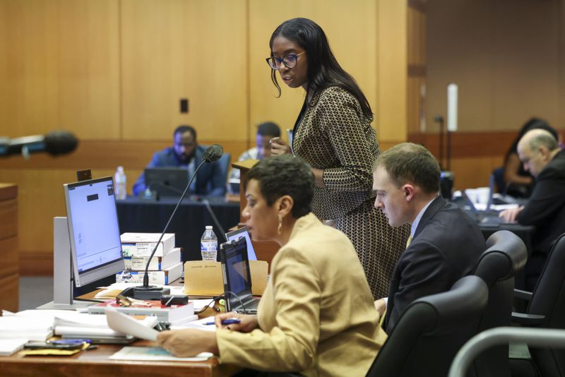 Fulton County prosecutor Simone Hilton, standing, speaks to the judge next to Chief Deputy District Attorney Adriane Love during the Atlanta Rapper Young Thug trial at the courtroom of Judge Ural Glanville at the Fulton County Courthouse, Friday, March 22, 2024, in Atlanta. (Jason Getz / jason.getz@ajc.com)