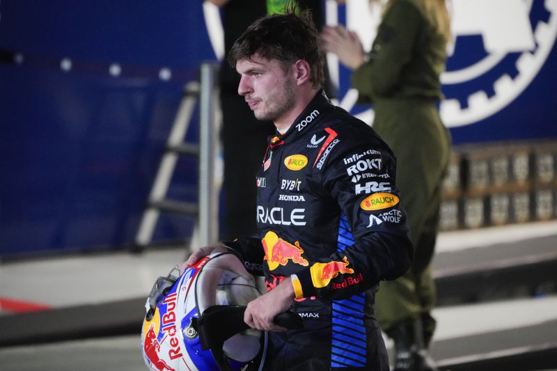 Red Bull driver Max Verstappen of the Netherlands reacts after his second place finish in the Singapore Formula One Grand Prix at the Marina Bay Street Circuit, in Singapore, Sunday, Sept. 22, 2024. (AP Photo/Vincent Thian)