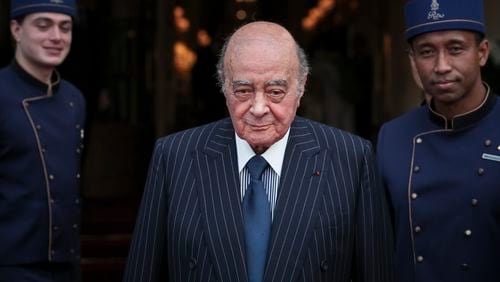 FILE - Egyptian businessman and Ritz hotel owner Mohammed Al Fayed poses with his hotel staff in Paris, Monday, June 27, 2016. (AP Photo/Kamil Zihnioglu, File)