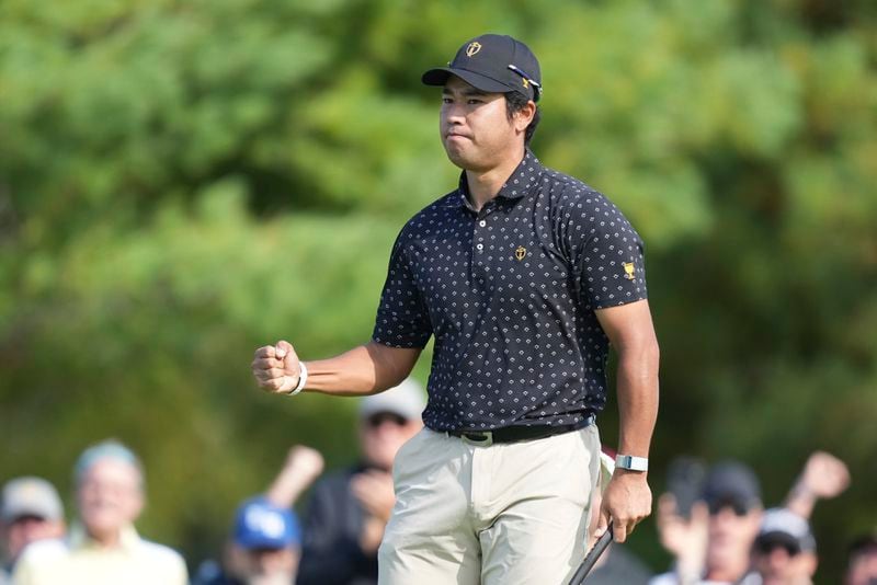 International team member Hideki Matsuyama, of Japan, reacts after making a putt on the seventh hole during a first round four-ball match at the Presidents Cup golf tournament at the Royal Montreal Golf Club in Montreal, Thursday, Sept. 26, 2024. (Christinne Muschi/The Canadian Press via AP)