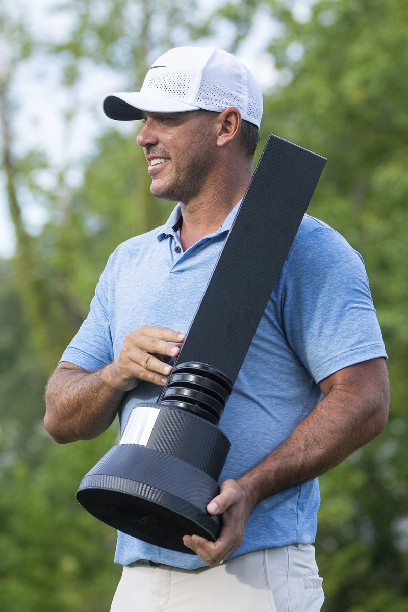 Individual Champion captain Brooks Koepka, of Smash GC, poses with the trophy after the LIV Golf Greenbrier at The Old White at The Greenbrier, Sunday, Aug. 18, 2024, in White Sulphur Springs, W.Va. (Mike Stobe/LIV Golf via AP)