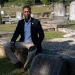Atlanta Councilmember Jason Winston sits in the original section of the South-View Cemetery Friday, June 21, 2024. Winston secured funding for the cemetery, chartered in 1886 by formerly enslaved people, to apply to the National Register of Historic Places. (Ben Gray / Ben@BenGray.com)