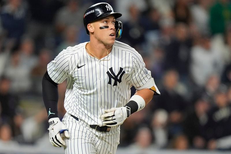 New York Yankees outfielder Aaron Judge watches his fly ball as he heads down the baseline during the third inning of Game 2 of the American League baseball playoff series against the Kansas City Royals, Monday, Oct. 7, 2024, in New York. (AP Photo/Frank Franklin II)